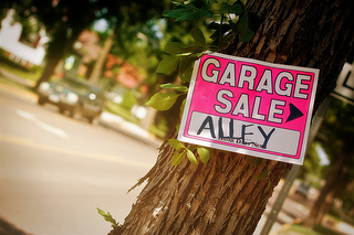 Garage sale sign on tree